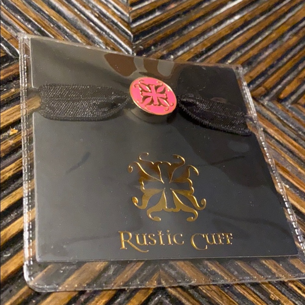 RC black elastic bracelet with pink/gold emblem